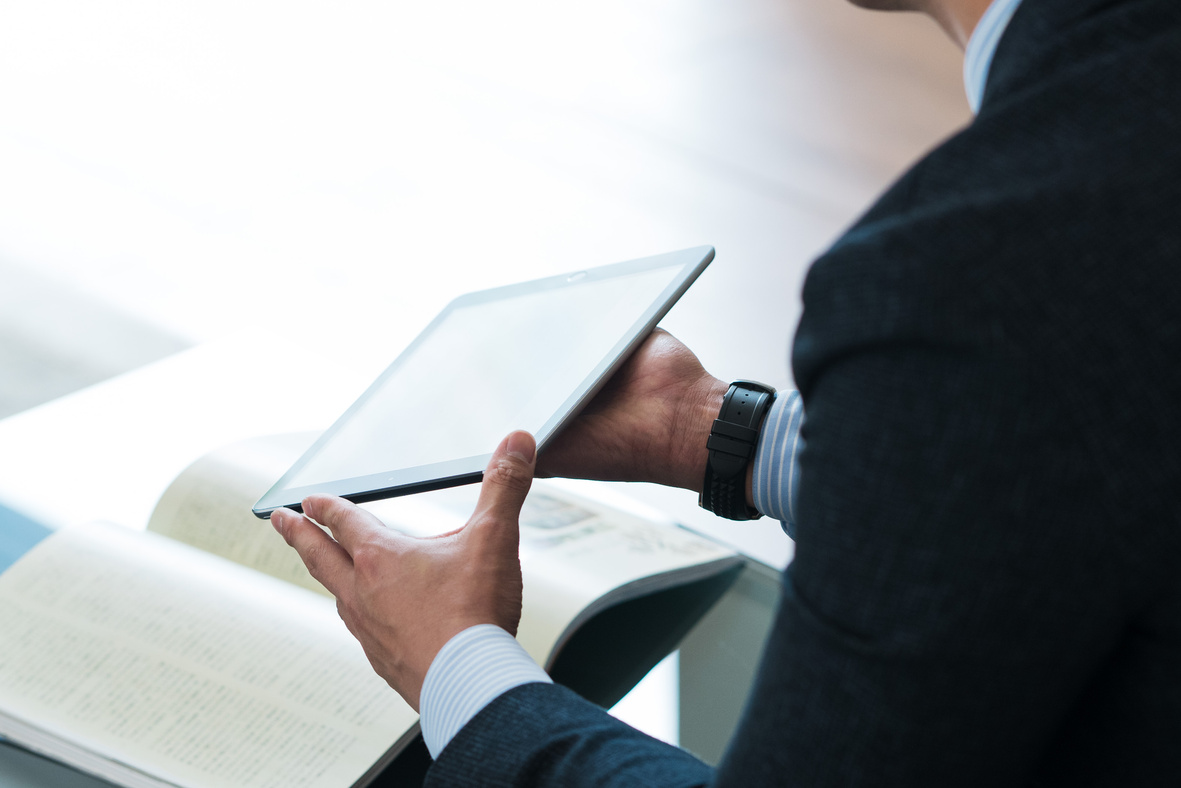 Car Salesperson Presenting Using a Tablet